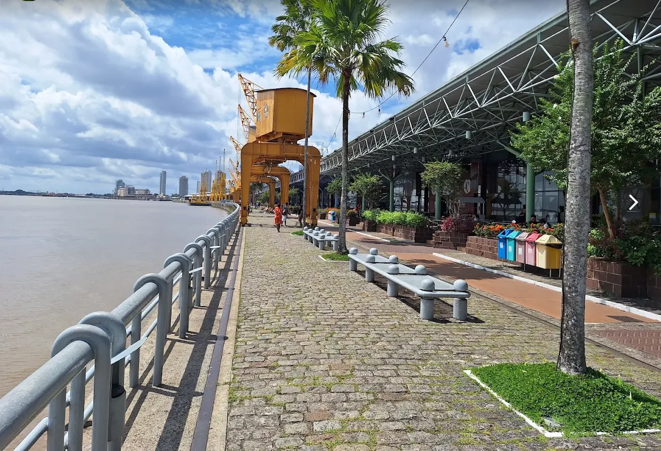 Estação das Docas waterfront with river, cranes, palm trees and warehouses
