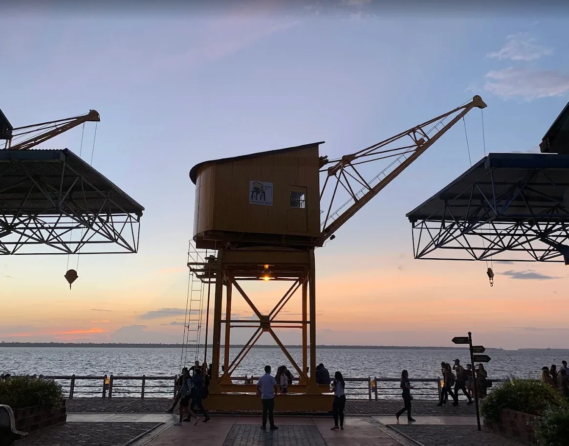 Estação das Docas crane at sunset over Guajará Bay
