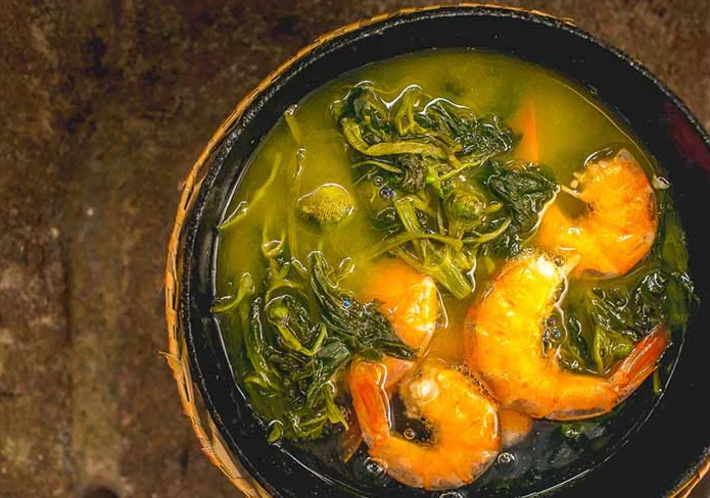 Bowl of tacacá with tucupi, jambu and shrimp