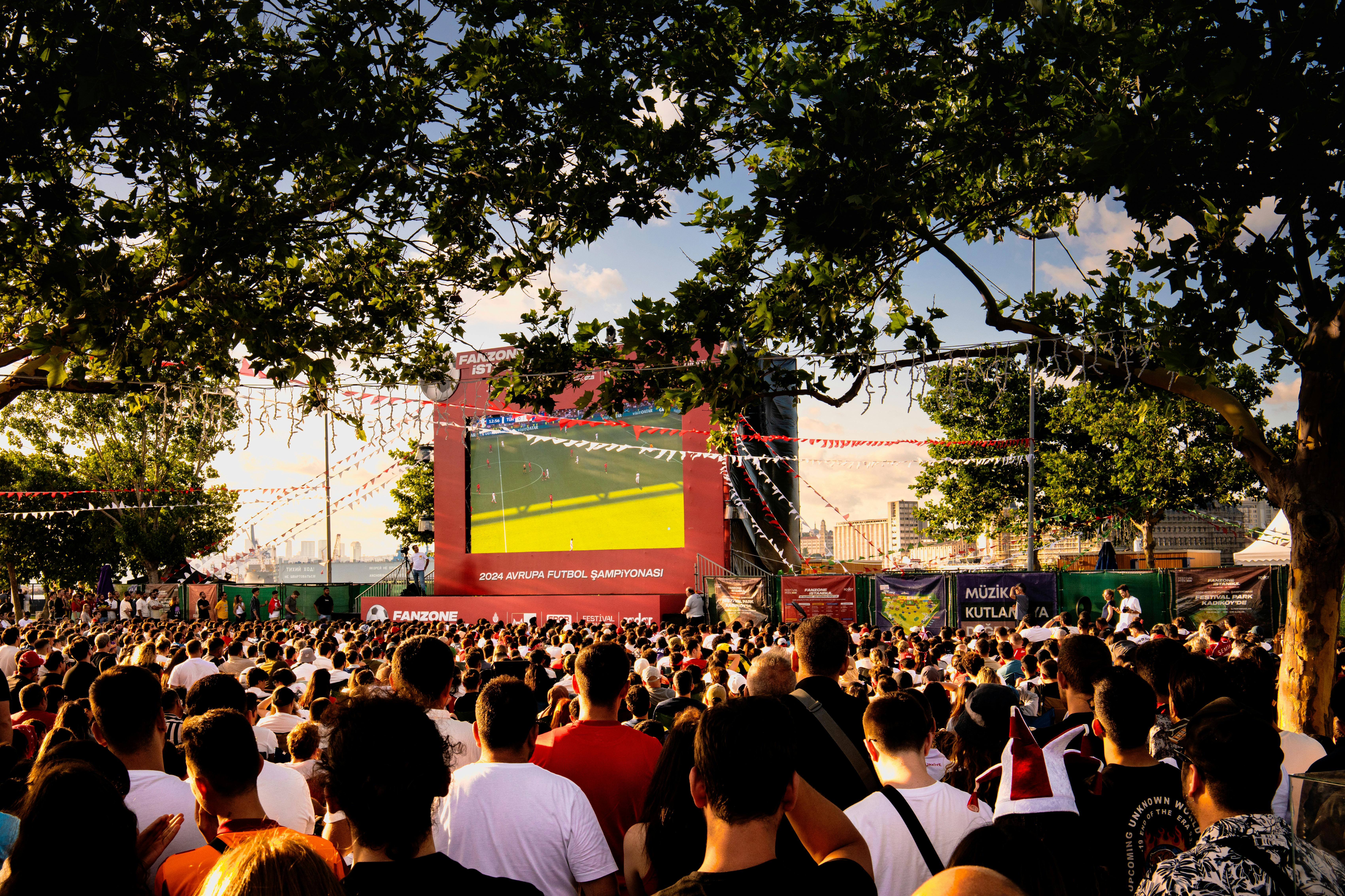 Fan festival — giant screen and a crowd in full celebration